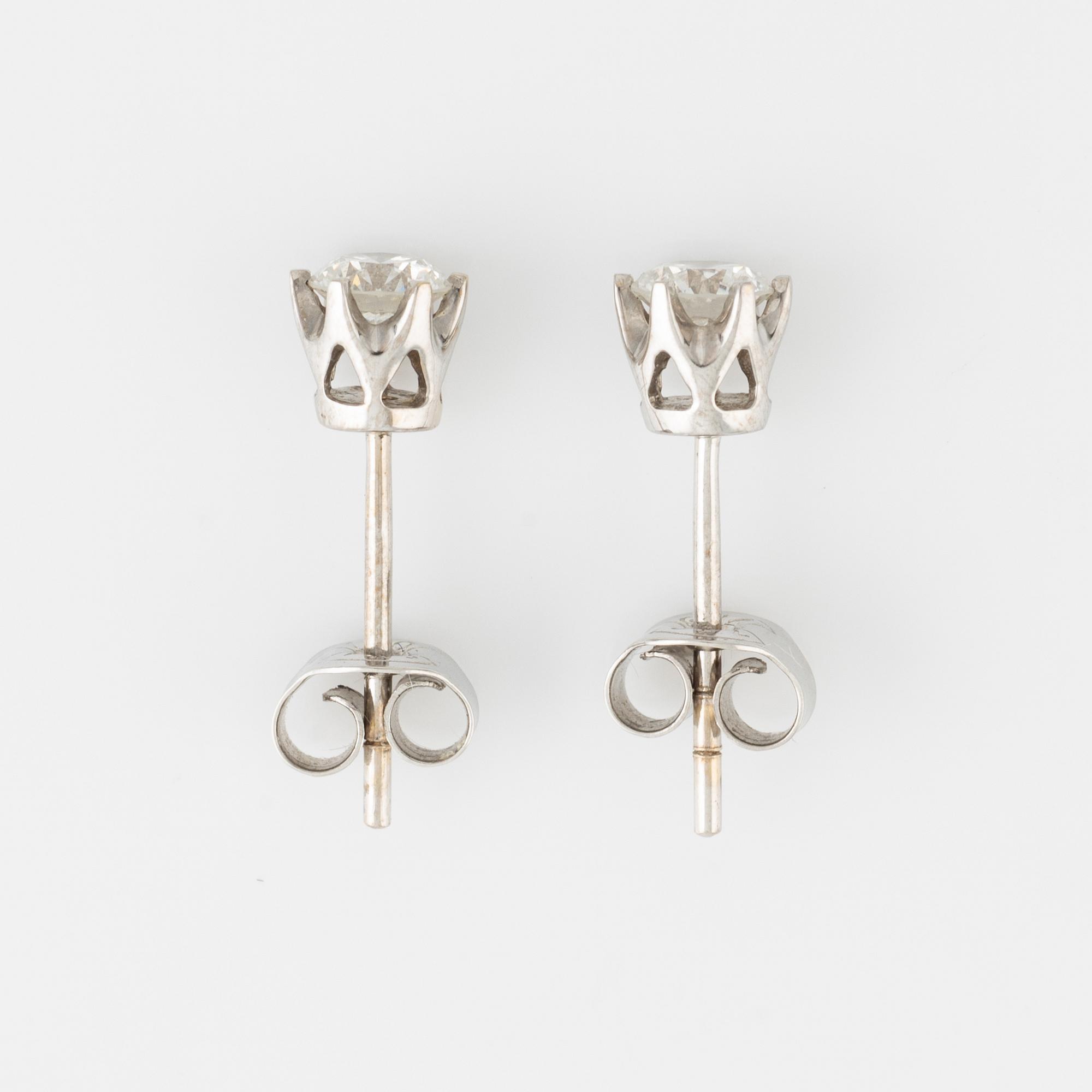 Brilliant cut diamond stud earrings.