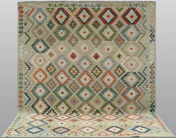 A Kilim carpet, classic design, approx. 305 x 259 cm.