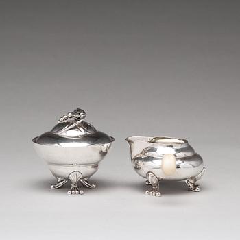 Georg Jensen, a "Blossom" sugarbowl and creamer, Copenhagen 1919-21, 830/1000 silver.