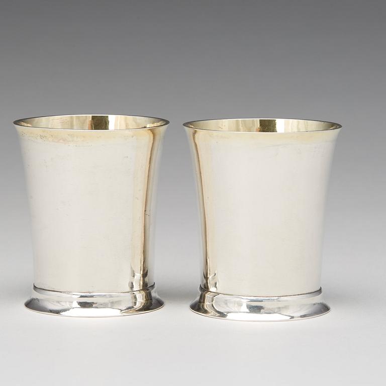 A pair of Swedish Empire parcel-gilt beakers, mark of Lorenz Georg Weis, Norrkoping 1814.