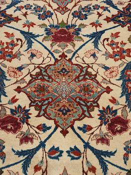 A old Esfahan carpet, around 299 x 210 cm.