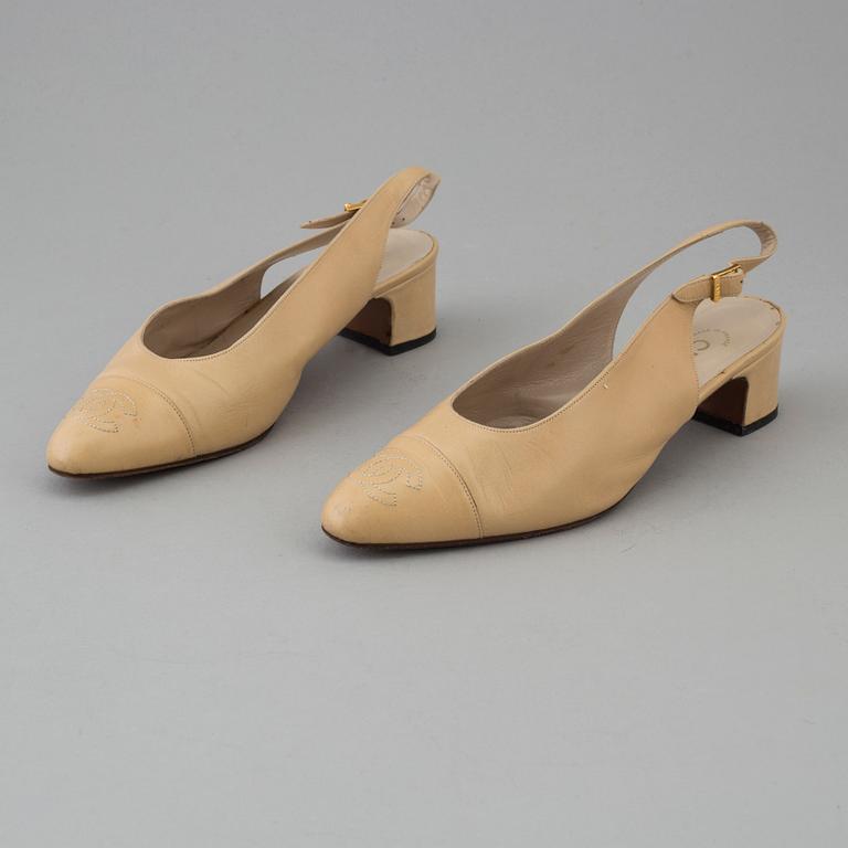 Beige leather slingbacks by Chanel.
