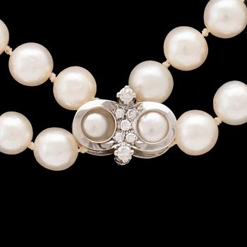 A necklace with cultured pearls and clasp in 18K white gold with round brilliant-cut diamonds, Hellström & Åhrling 1981.