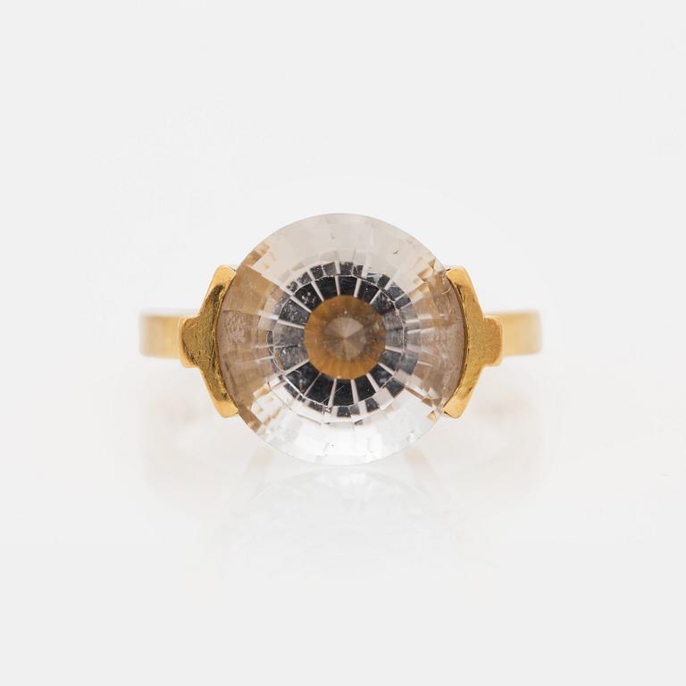 Wiwen Nilsson, an 18k gold ring with a facet cut rock crystal, Lund 1962.