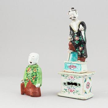 Two famille rose figurines and base, Qing dynasty, 19th Century.