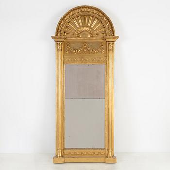 An Empire mirror, first half of the 19th Century.