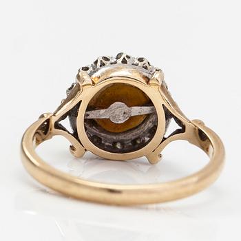 A 9K gold ring with a cultured pearl and diamonds ca. 0.035 ct in total. United Kingdom.