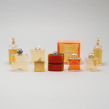 HERMÈS, seven factices and one perfumebottle.