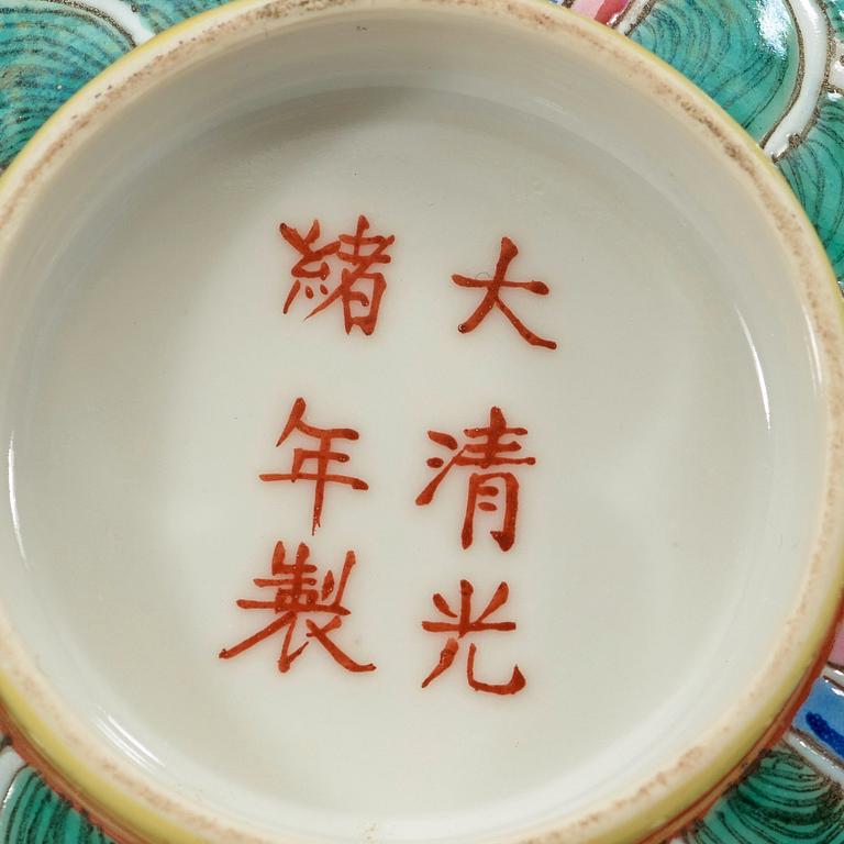 A famille rose yellow ground bowl, Qing dynasty, Guangxu six-character mark in red and of the period  (1875-1908).