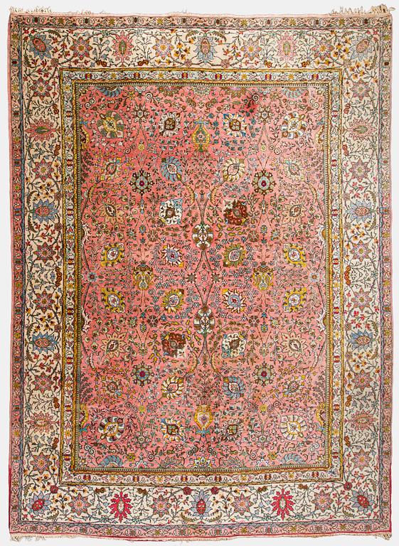 A Tbriz carpet of Safavid 'vase' design, approx. 397x295 cm.