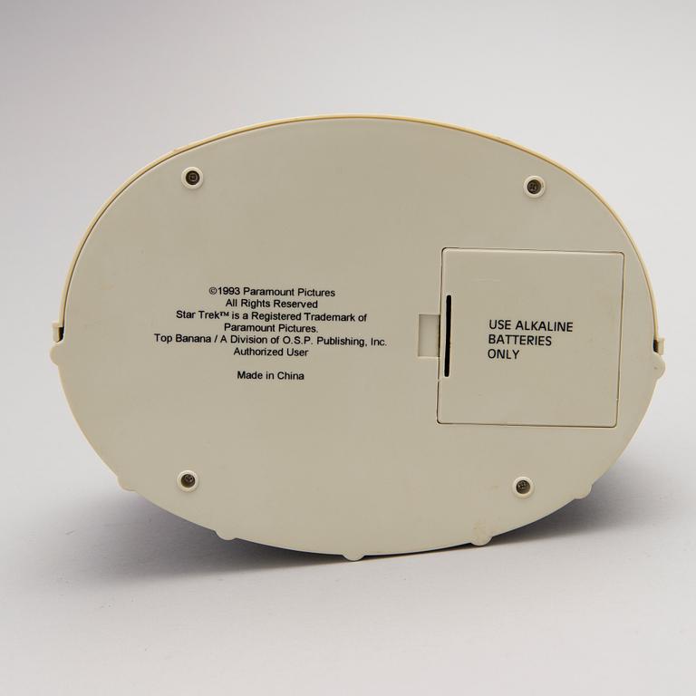 Three Vintage Toy Robots and a Table Clock.