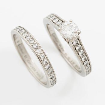 Cartier two rings platinum with round brilliant-cut diamonds.