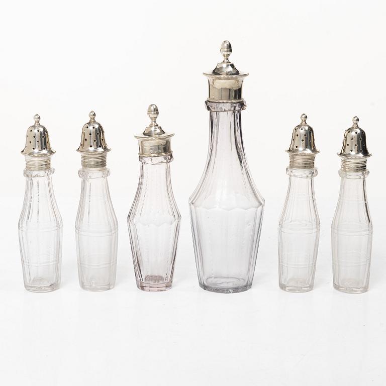 Parts for a table centrepiece, six glass bottles, and seven lids in silver, marked Pehr Zethelius, Stockholm 1807.
