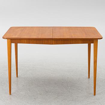 A mid20th century dining table.