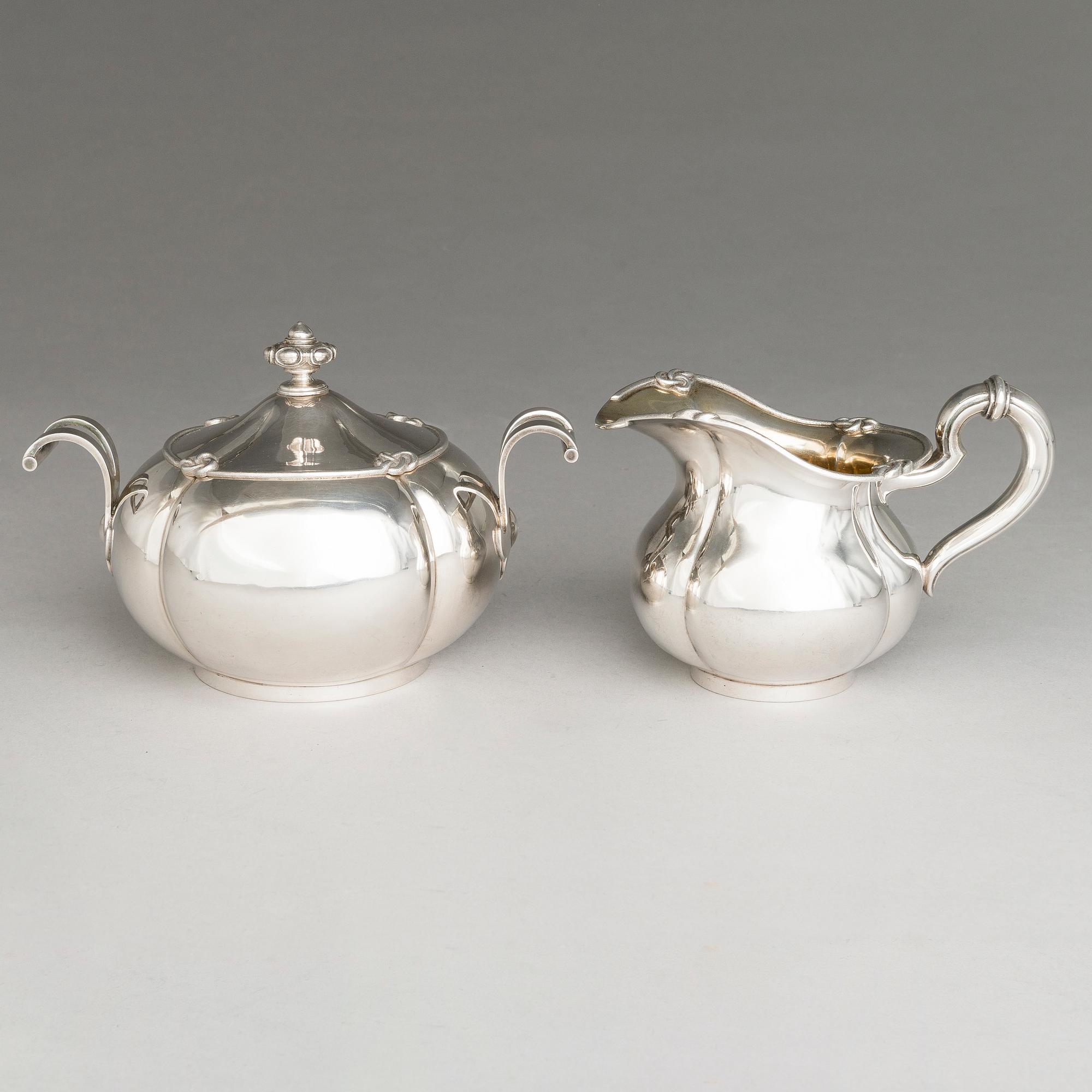 SAZIKOV, A 5-piece silver coffee and tea set, mark of the Sazikov Firm, Imperial Warrant, Saint Petersburg 1860.