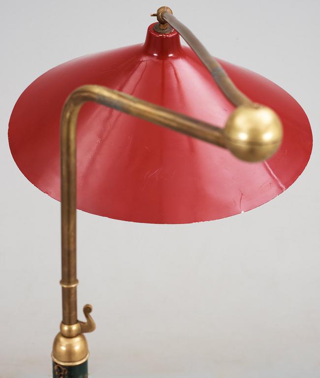 An Italian brass and leather floor lamp, Arredoluce, circa 1950, red lacquered tin shade.