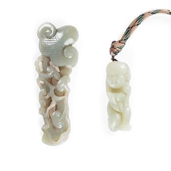 1007. A nephrite pendant and sculpture, 20th Century.