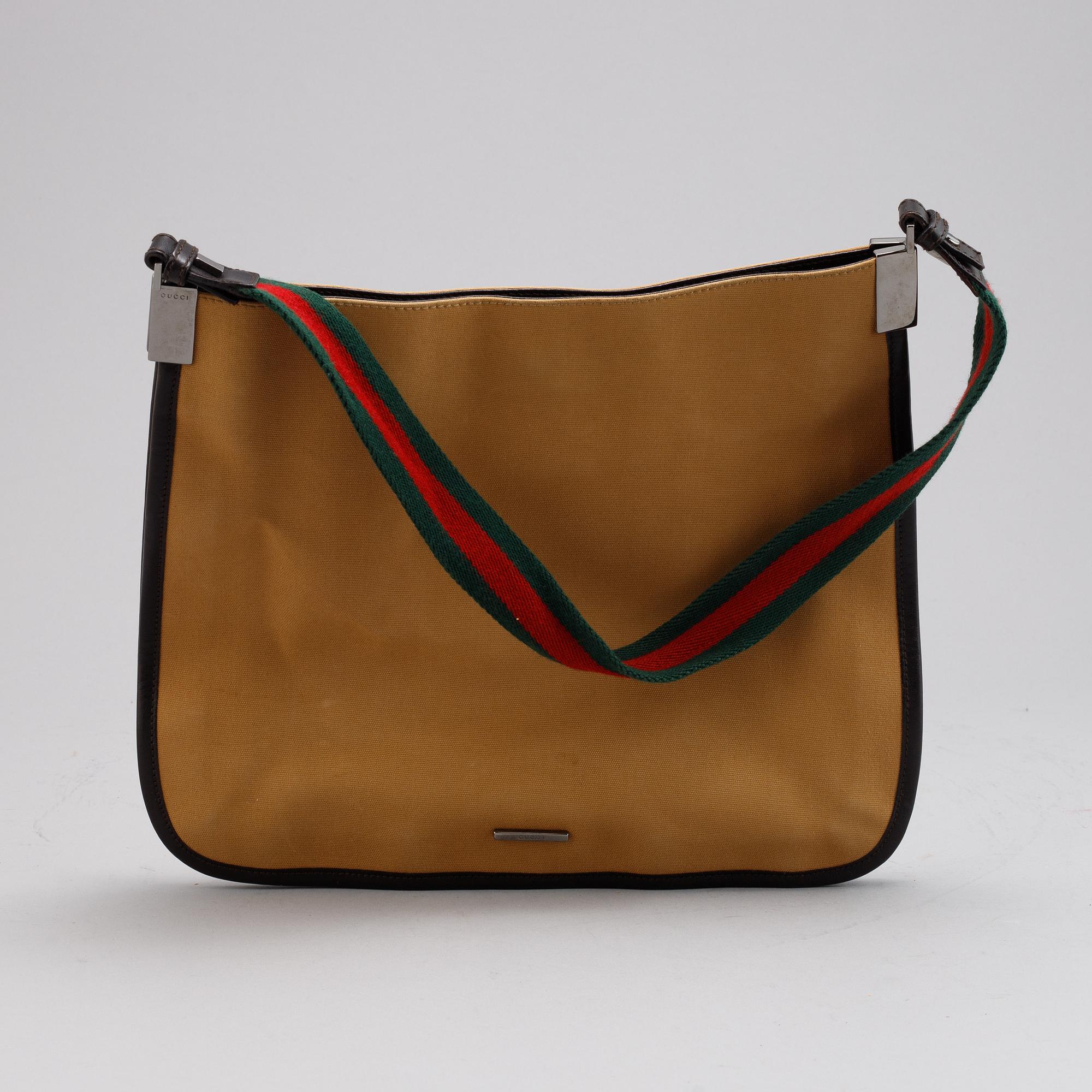 Gucci, a canvas handbag.