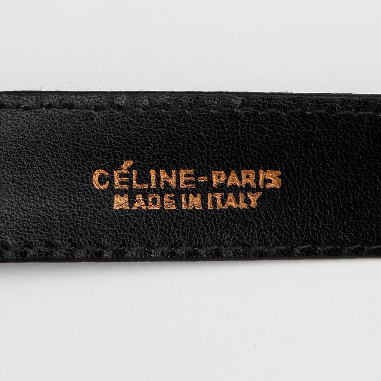 CÉLINE, a black lacquer leather belt.