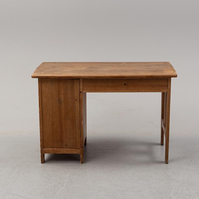 A stained pine writing desk attributed to Carl Westman, early 20th Century.