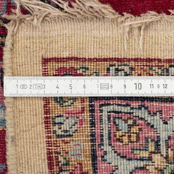 A semi-antique Kirman carpet, c. 366 x 270 cm.