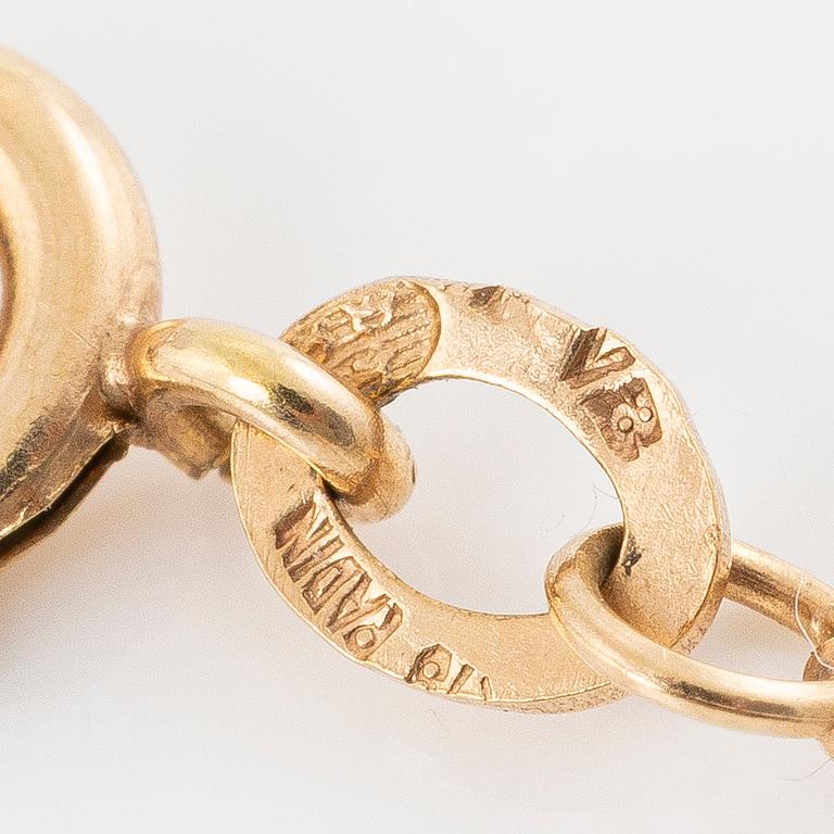 Hänge 18K guld med blå syntetisk sten.