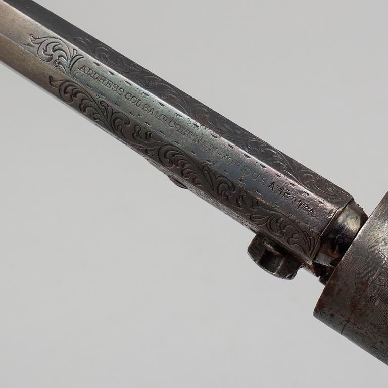 A Colt 1862 Pocket Navy percussion revolver with ivorygrip.