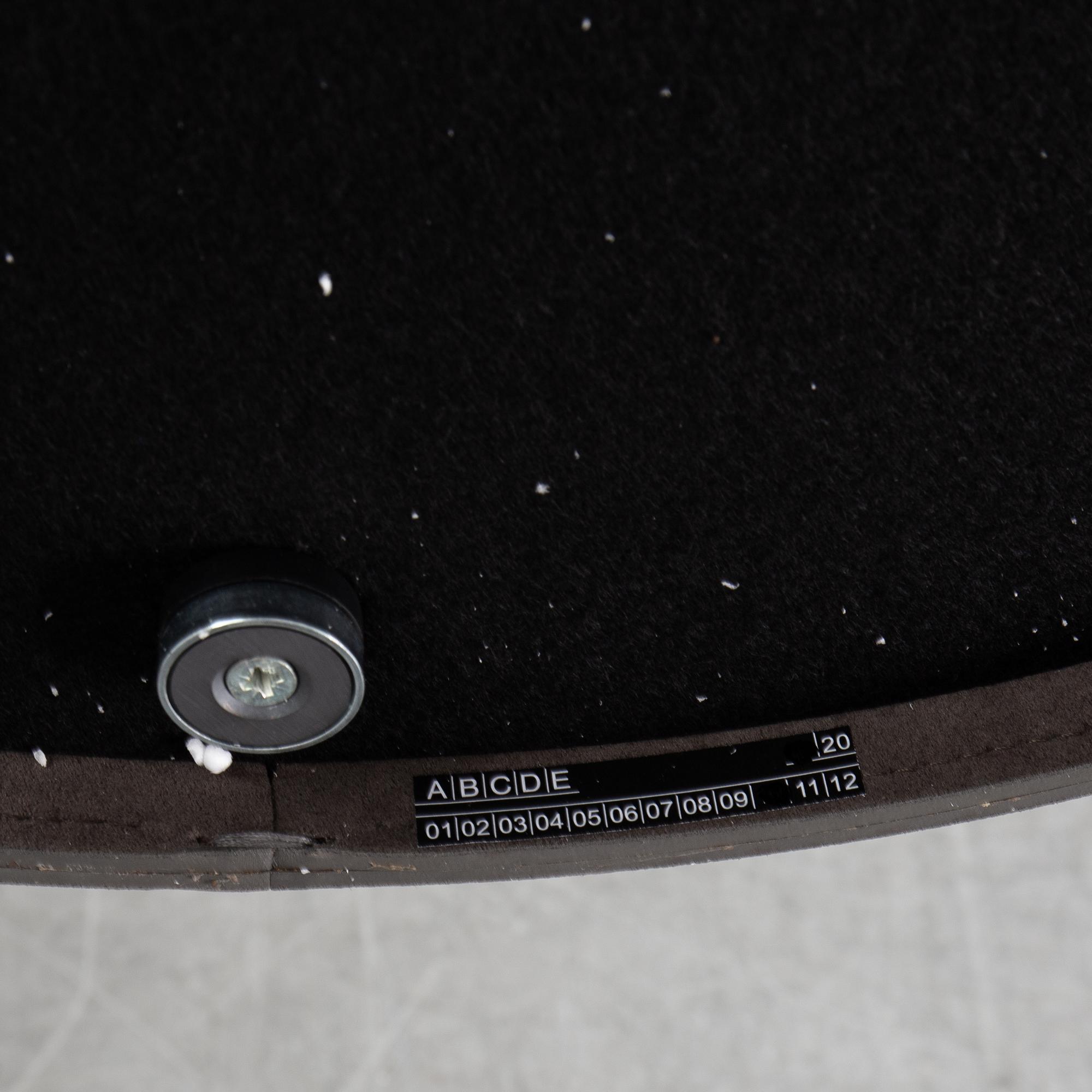 A mirror "Adnet" with leather hanging in original box, designed 1950 by Jacques Adnet for Gubi, Denmark.