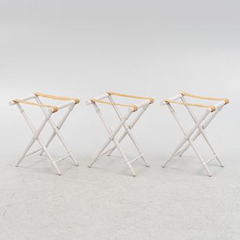 A set of three luggage stands, 20th century.