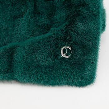 BVLGARI, a green mink stole.