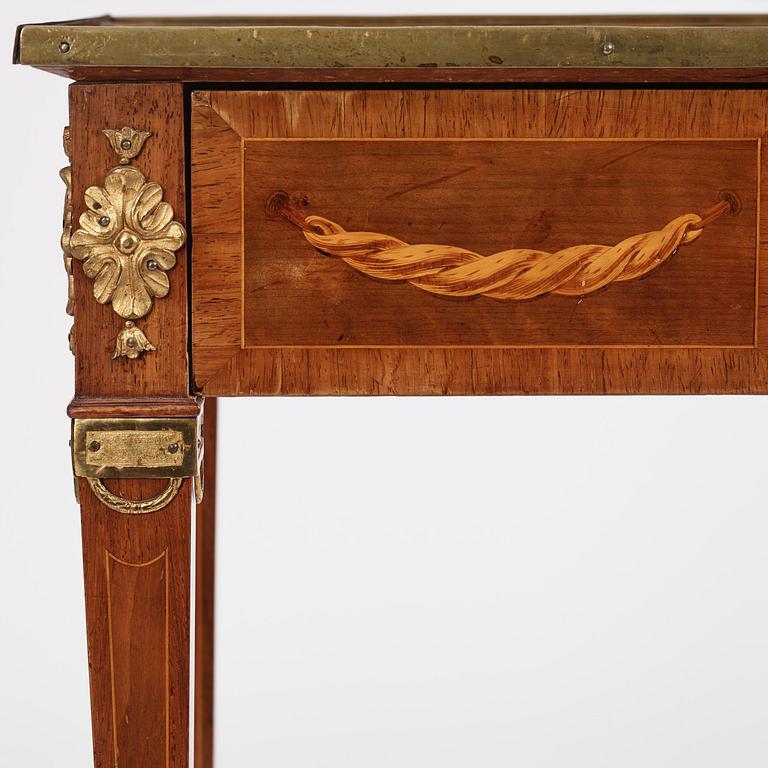 A Gustavian marquetry and gilt brass-mounted table by G. Iwersson (master in Stockholm 1778-1813).