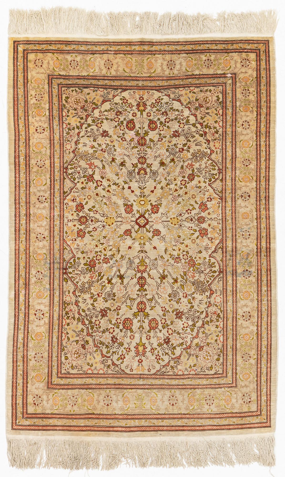 A Hereke silk rug, c. 130 x 87 cm.
