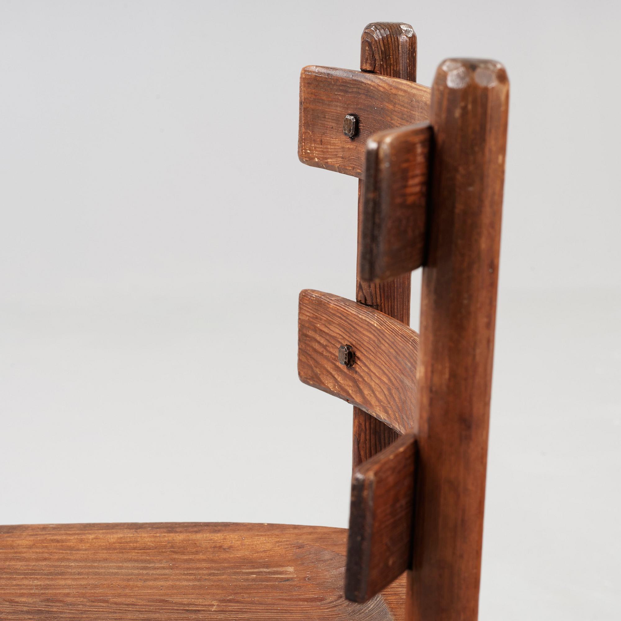 A pair of Axel Einar Hjorth stained pine 'Sandhamn' chairs.