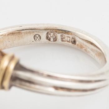 An Ilias Lalaounis ring in silver and 18K gold with sodalite.