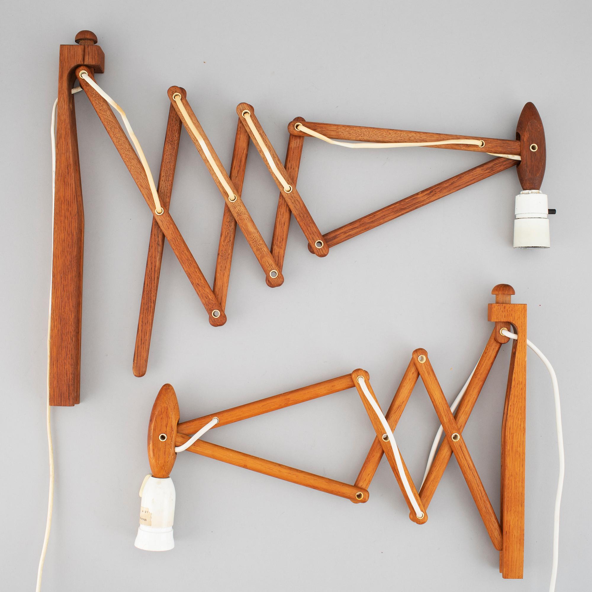 Two Le klint wooden wall lamps.