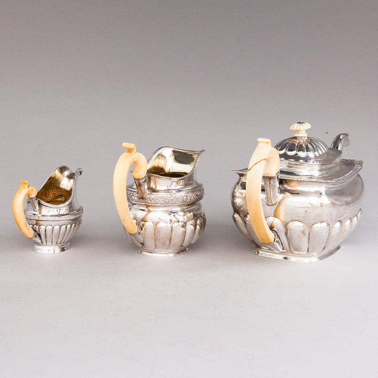 A Russian silver teapot and two silver milk jugs, St Petersburg 1824-1839, jugs marked Georg Randelin and Thomas Sohka.