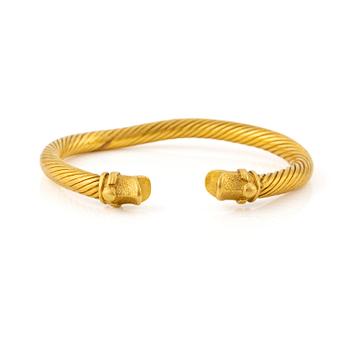 209. A Greco-Roman style presumably modern gold bracelet.