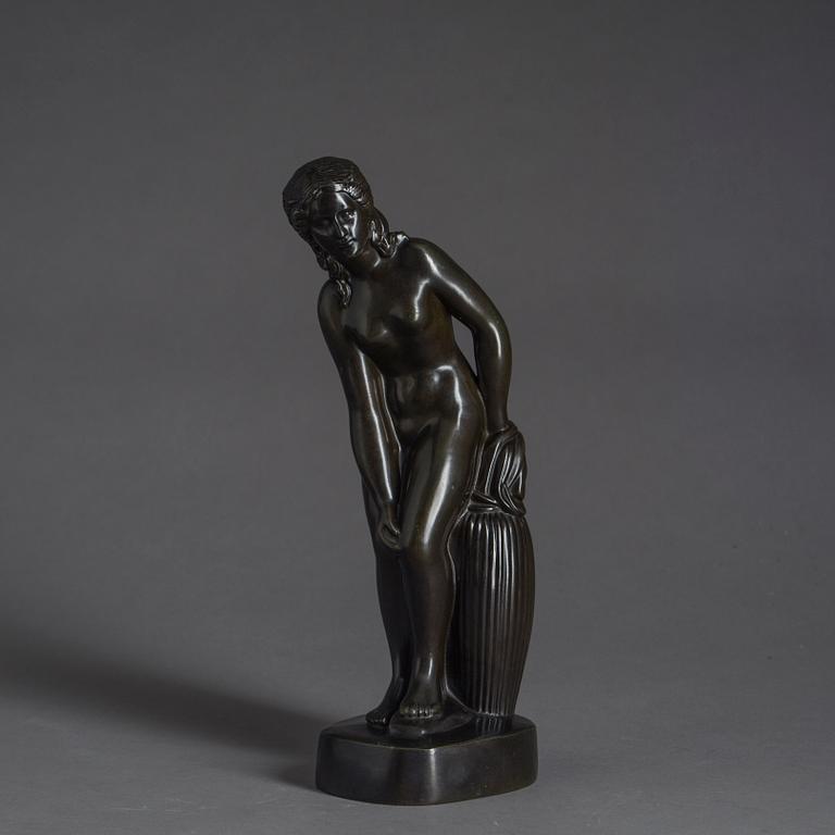 JUST ANDERSEN, a signed metal sculpture.