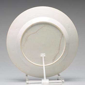 A set of four blue and white armorial dinner plates, Qing dynasty, 18th Century.