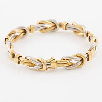 A bracelet in 18K gold and white gold.