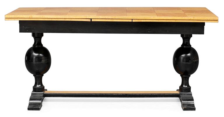 A Swedish birch burrwood and black laquered library table, 1920's.