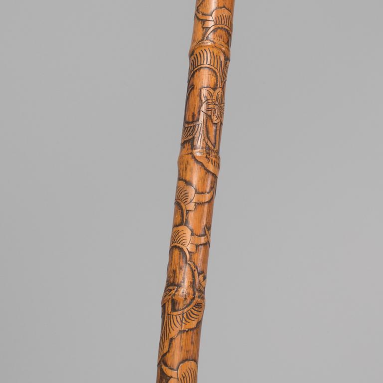 A CHINESE BAMBOO WALKING STICK, latter part of the 19th century.