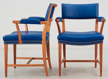 A pair of Josef Frank mahogany and blue leather armchairs, Svenskt Tenn, model 695.