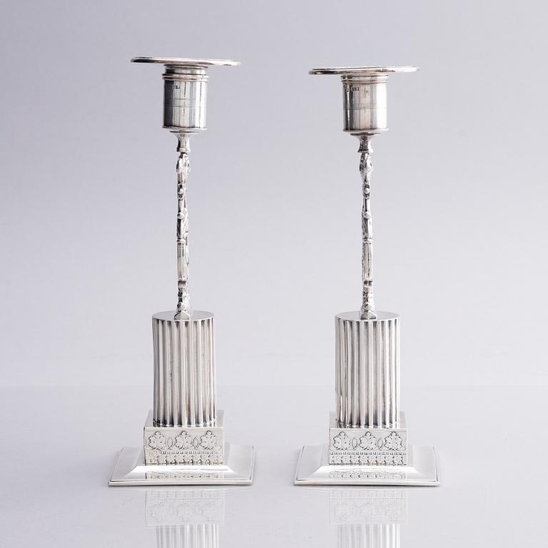 A pair of Swedish silver candlesticks, marks of Gustaf Folcker, Stockholm 1825.