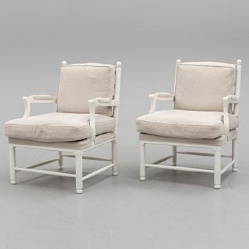 A pair of second half of the 20th century arm chairs.