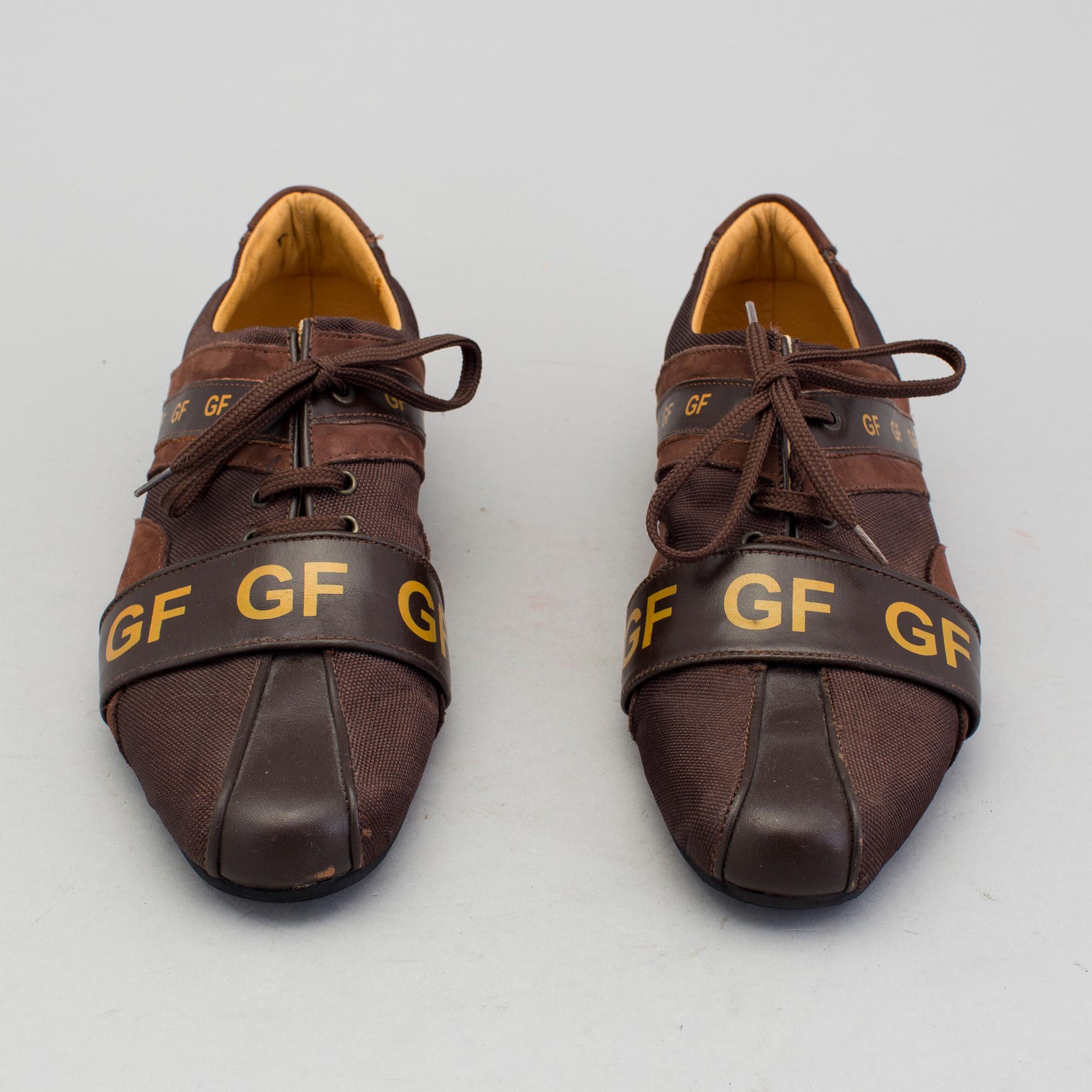 a pair of sneakers by Gianfranco Ferre.