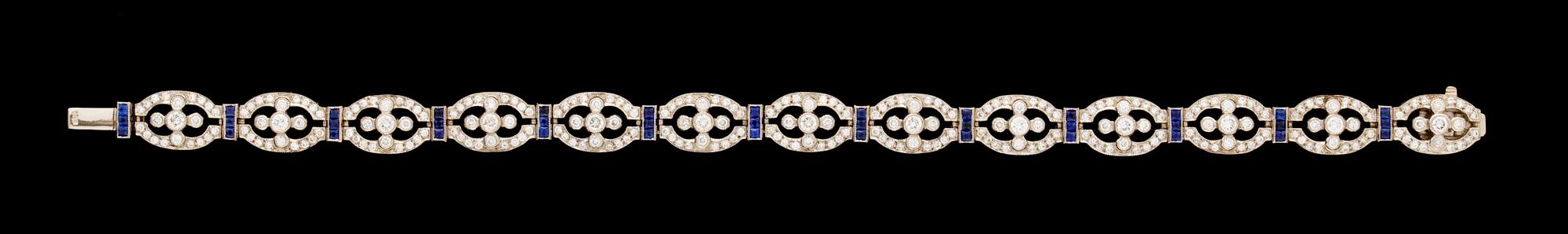 A gold diamond and sapphire bracelet.
