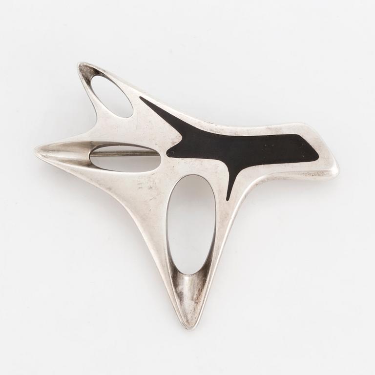 HENNING KOPPEL, a sterling silver and enamel brooch from Georg Jensen, Denmark.