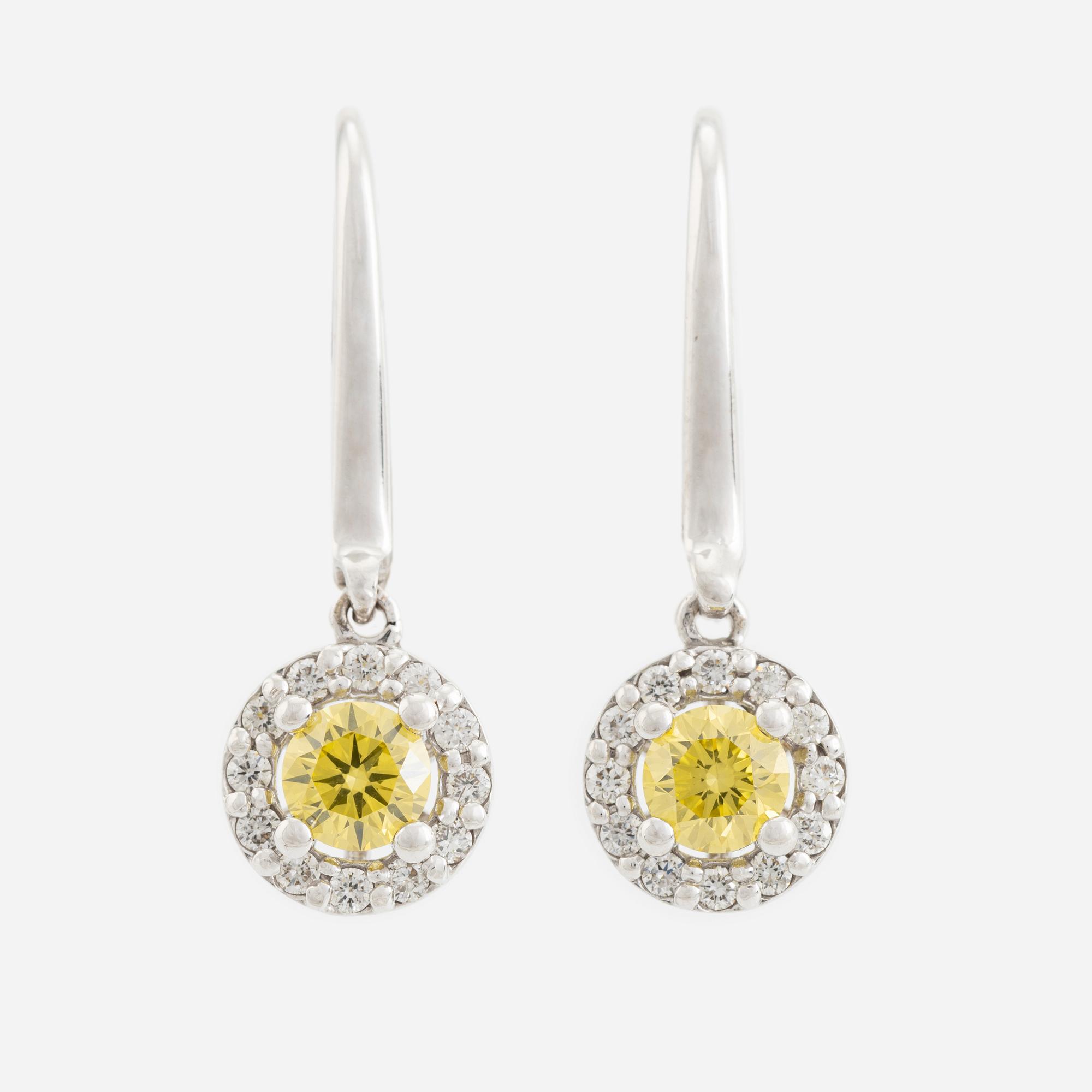 Colour treated brilliant cut diamond earrings.