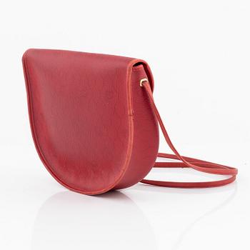 Christian Dior, a red vintage bag.